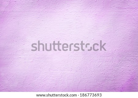 Architectural background of a rough plaster texture with a stippled effect in a pretty shade of lilac or light purple in a 2014 fashion color with light vignetting and copyspace