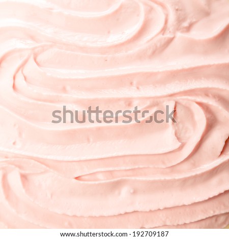 Tasty cold pink berry frozen yoghurt or ice cream background with a smooth creamy texture for a delicious refreshing summer dessert