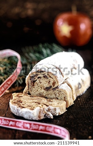 Delicious spicy fresh panettone sweet bread with traditional spices, raisins and candied fruit topped with powdered sugar for a tasty snack or dessert at Christmas or advent