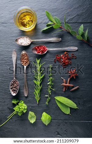 Food Elements and Spoon on Black Wooden Table