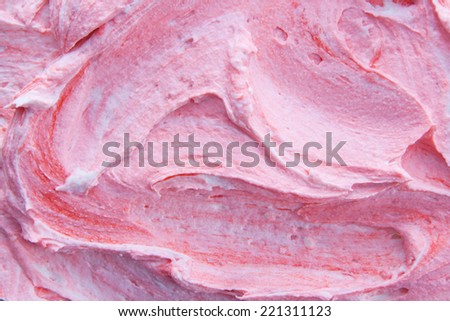 Background texture and pattern of swirled pink berry frozen yogurt for a delicious refreshing summer dessert or sweet