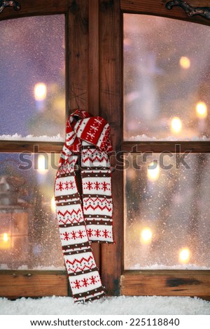 Close up Christmas Scarf Hanging at Vintage Wooden Window Pane