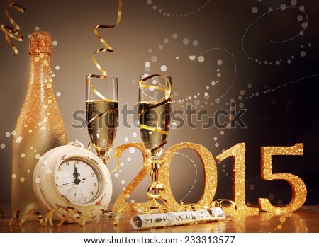 2015 New Years Eve celebration background with an elegant arrangement with a clock counting down to midnight, flutes and bottle of champage and party streamers with a cracker, bubble bokeh