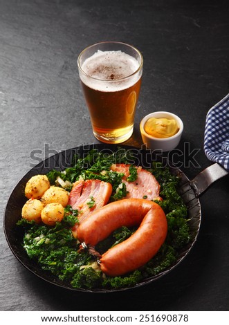 Close up Healthy German Recipe with Mustard Sauce on Side, Served on Wooden Table with Beer.