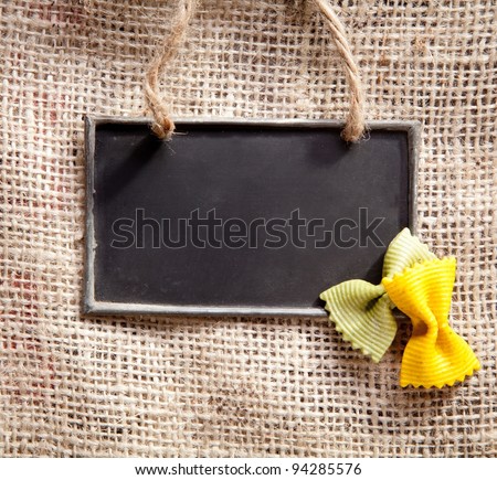 a chalkboard on a textile coffee bag with pasta