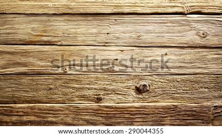Old rustic rough textured weathered wood table or boards background viewed close up from above, full frame