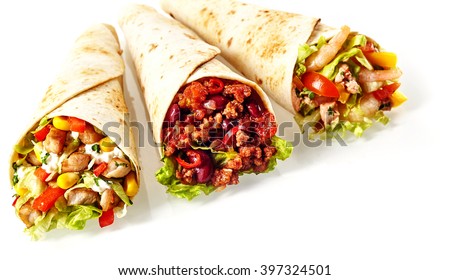 Close Up Still Life of Trio of Tex Mex Fajita Wraps Wrapped in Grilled Flour Tortillas and Filled with Variety of Fillings Such as Chicken, Chili and Shrimp and Fresh Vegetables on White Background