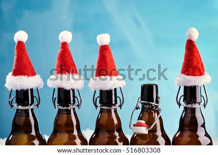 Winter beer bottle merry christmas party. Beer Bottles in a row with funny christmas hats for xmas happenings