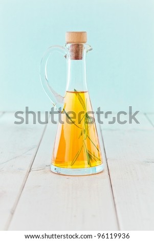 A conical bottle of cold-pressed extra-virgin olive oil for use as a salad dressing and in cooking.