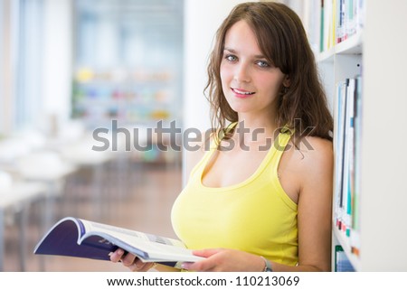 Pretty young college student in a library (shallow DOF; color toned image)