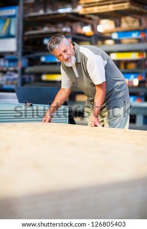 Man buying construction wood in a  DIY store