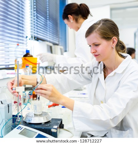 Portrait of a female researcher carrying out research in a chemistry lab (color toned image; shallow DOF)