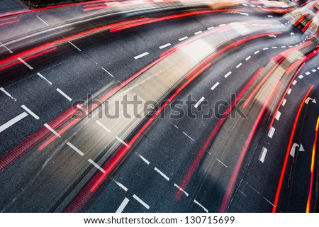 Motion blurred city road traffic color toned image Motion blurred city road traffic color toned image