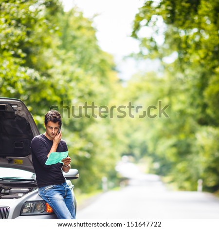 Handsome Young Man Calling For Assistance With His Car Broken Down By The Roadside