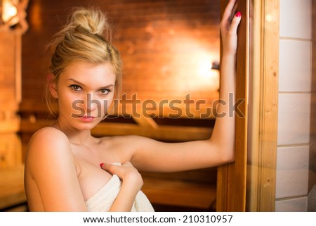 Young woman relaxing in a sauna, taking a break from her busy schedule, taking care of herself, enjoying the wellness benefits her job provides