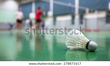 Badminton - badminton courts with players competing