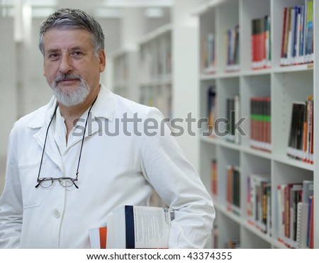 Renowned scientist/doctor in a library of research center/hospital looking confident