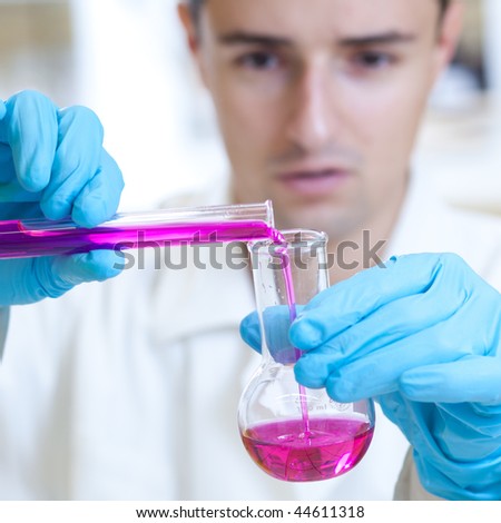 young male researcher carrying out scientific research experiments in a laboratory