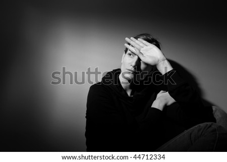 Young woman suffering from severe depression/anxiety  (B&W image)