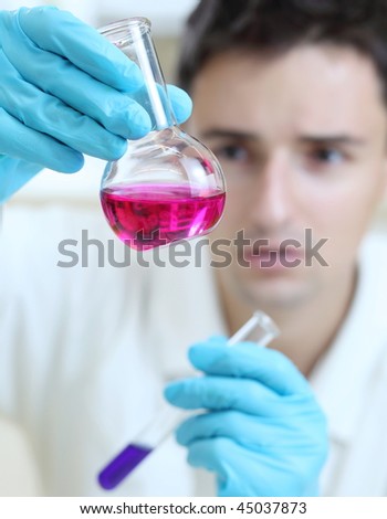 young male researcher carrying out scientific research