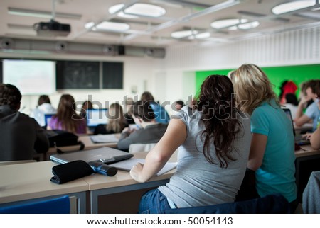 college students in class. college student sitting in