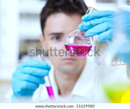 young male researcher carrying out scientific research in a lab