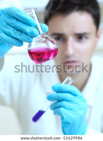 young male researcher carrying out scientific research in a lab