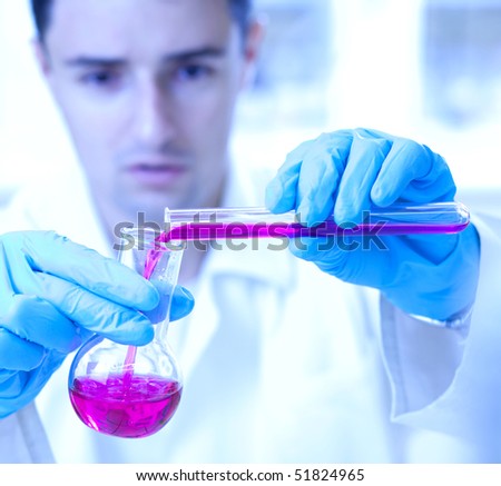 close-up portrait of a young male researcher carrying out experiments in a research lab