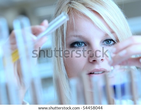 Closeup of a female researcher carrying out experiments in a lab