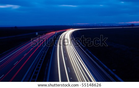 Cars moving fast on a highway