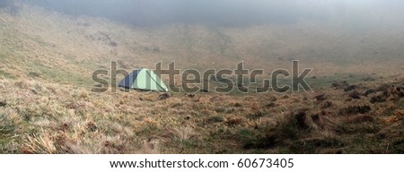 tent in a landscape on a misty morning