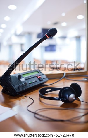 interpreting - Microphone and switchboard in an simultaneous interpreter booth