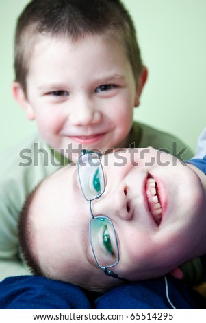 two little brothers happy together (shallow DOF; color toned image)