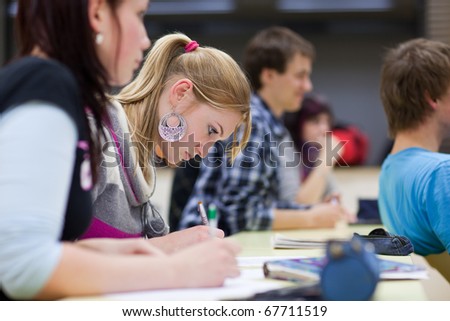 college students in class. college student sitting in