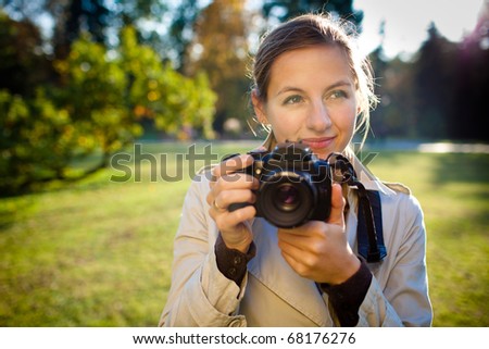 pretty female photographer outdoors