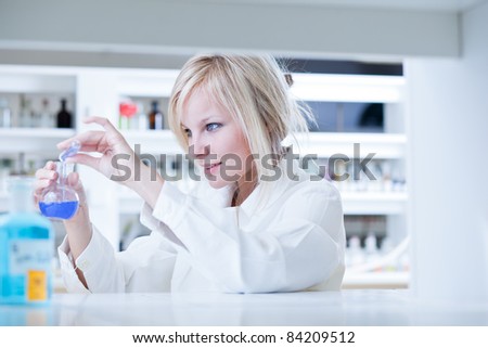 portrait of a female researcher doing research in a lab (color toned image)