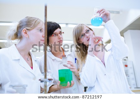 portrait of a female researchers/chemistry students carrying out research in a chemistry lab (color toned image; shallow DOF)