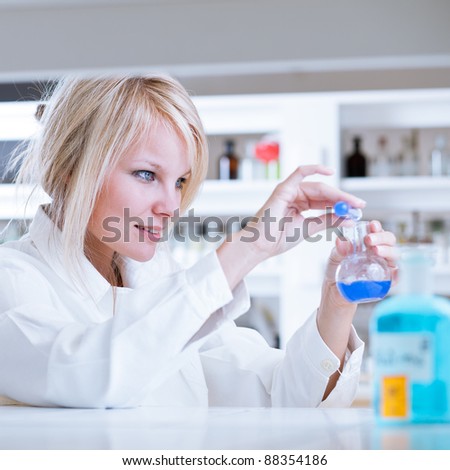 portrait of a female researcher/chemistry student carrying out research in a lab