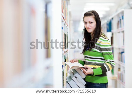 pretty, young college student in a library (shallow DOF; color toned image)