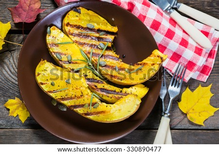 Slices of pumpkin with rosemary grilled