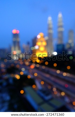 Blur image or bokeh light of Kuala Lumpur night scenery during blue hour.  Intentionally added blue tones to make the it look more atmospheric.