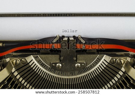 Dollar word printed on an old typewriter