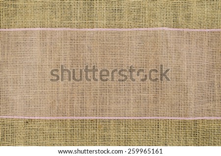 Pink ribbon on linen background