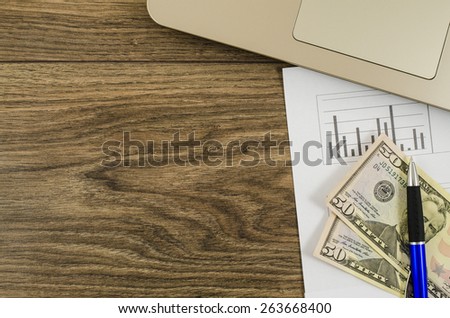 Office, business tools with dollar on wooden table
