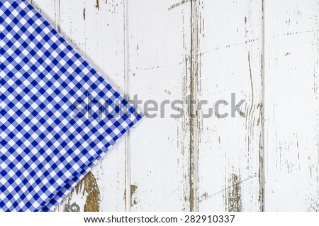 Blue tablecloth over wooden table