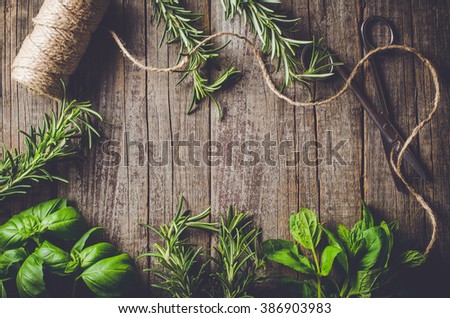 Mix of fresh herbs from garden on an old table