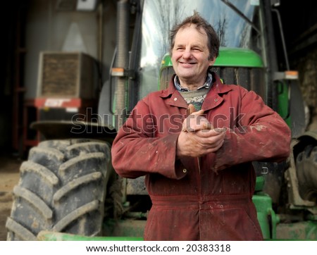 Happy farmer rubbing hands together