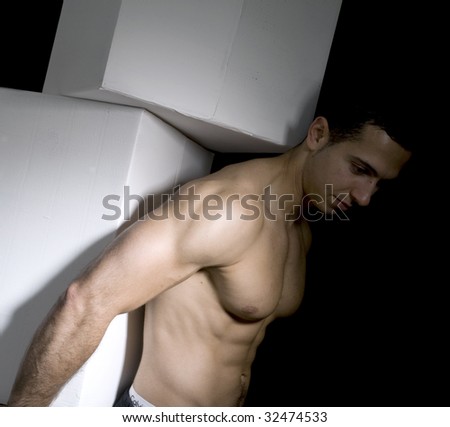 strong man holds white box with dark background