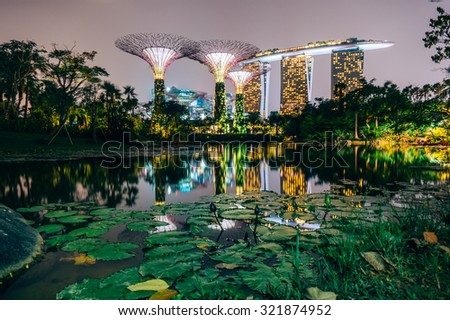SINGAPORE - FEBRUARY 28, 2015: Sunset scene of the Supertree Groove at Garden by the Bay. Garden by the Bay is one of the most famous tourist attraction in Singapore.