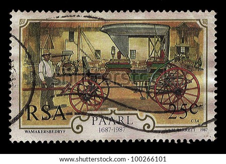SOUTH AFRICA - CIRCA 1987: A stamp Printed in South Africa shows wagon maker with horse drawn carriage in factory, dedicated 300 anniversary of wagon maker industry 1687-1987, circa 1987